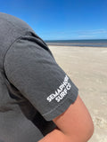 Close-up of the Semaphore Surf Co. wordmark on the sleeve of the pepper tee
